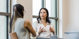 two female colleagues talking